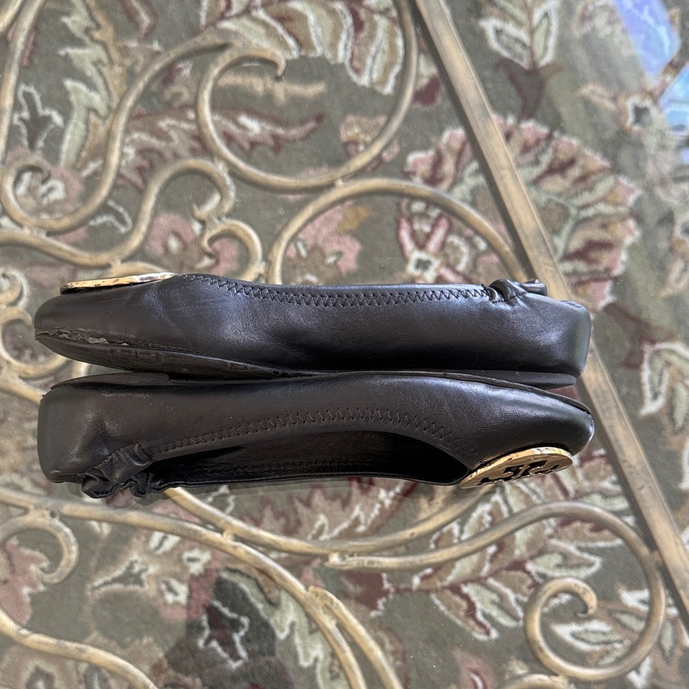 Tory Burch Gorgeous Black Flats with Gold Emblem - Picture 3 of 7